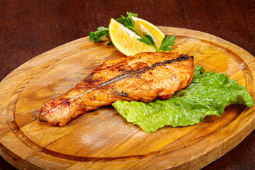 Roasted salmon steak served lemon