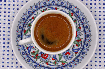 cup of Turkish coffee on a fabric background