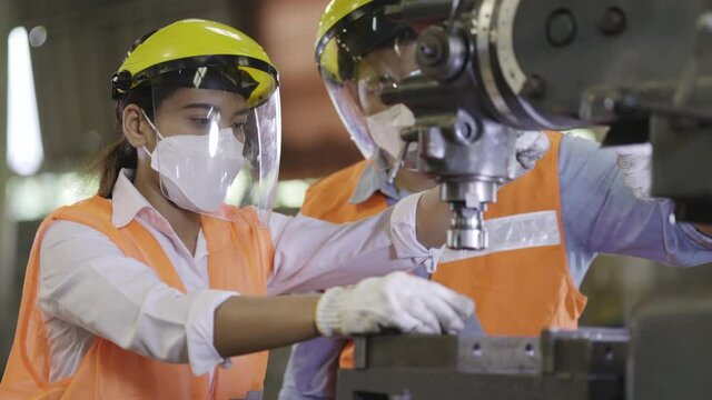 Team Asian machine engineers is providing maintenance services for machines in industrial plant. Repair and Check heavy machine quality to work with good efficiency. Wear safety equipment working.