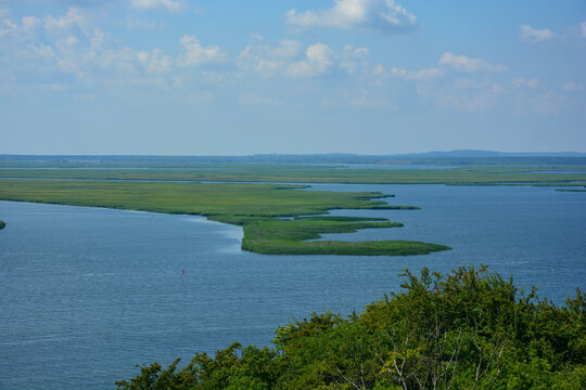 View of the lagoon in the Szczecin Lagoon near Lubin in Poland, inner coastal waters in the confluence of the Oder and Peene with a blue sky in summer