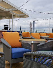 Luxury sun loungers and deck lounge chairs on outside terrace, patio or balcony sun deck of luxury...