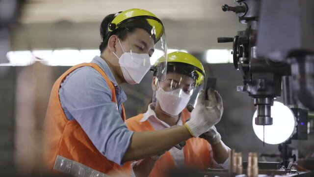 Team Asian machine engineers is providing maintenance services for machines in industrial plant. Repair and Check heavy machine quality to work with good efficiency. Wear safety equipment working.