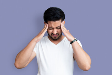 Close up photo of young age man perfect appearance arms hands on forehead. Terrible pain in eyes, closed wear casual white t-shirt isolated on background