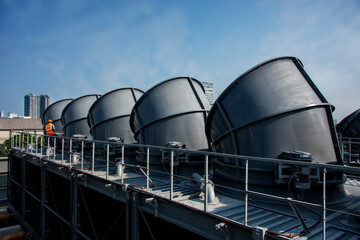 engineer under checking the industry cooling tower air conditioner is water cooling tower air...