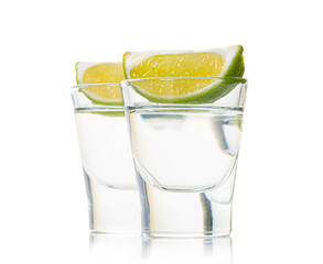 alcoholic drink  in a glass with lime