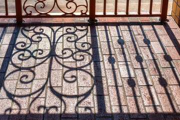 Light and shadows in a fence seen in Little Havana, Miami, Florida, 