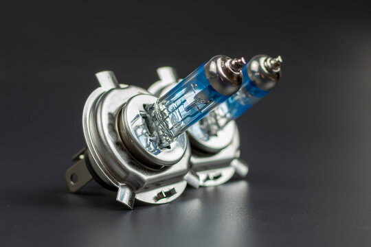 blue car head light bulb on black background