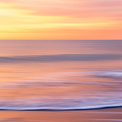 abstract landscape of sea. texture water, sky and sand in blurry motion in tropical sunset colors