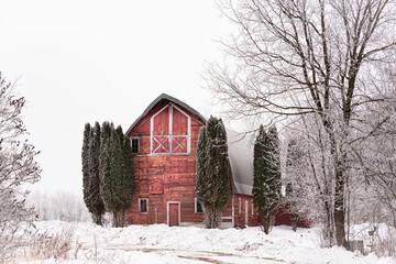 Red barn winter snow scene. 