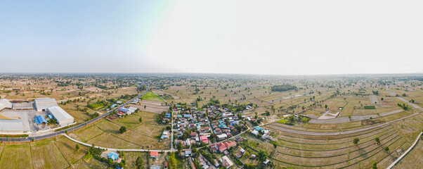 defaultPanoramic beautiful rural villages and rice fields in Thailand - Take a photo by drone camera