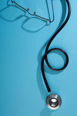stethoscope on blue background