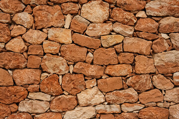 texture of a old red stone wall mediterrranean spain architecture, wall background	