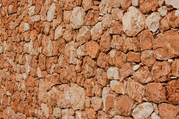 texture of a old red stone wall mediterrranean spain architecture, wall background	