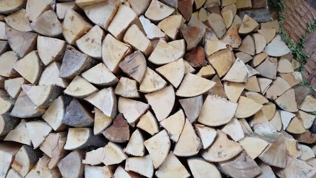 Stack of firewood close up. Logs cuts prepared for fireplace