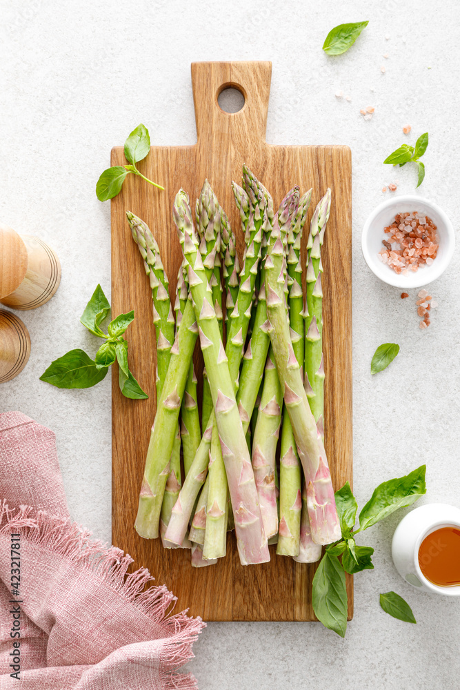 Sticker asparagus. cooking bunch of asparagus on kitchen table. top view