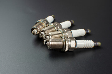 spark plugs for car close up on black background