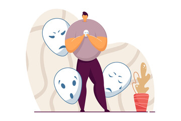 Man holding smiling mask covering emotions. Person standing with mask in hand, hiding his feelings. Angry, surprised, sad masks around man. Changing natural personality, conformity, hypocrisy concept