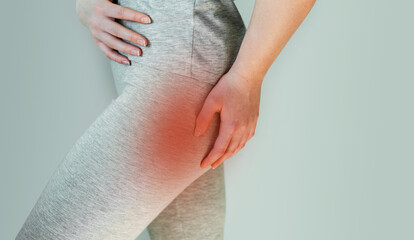A woman suffers from piriformis syndrome, pain in buttocks muscle caused by sciatic nerve irritation