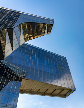 Modern and elegant glass building with blue reflections