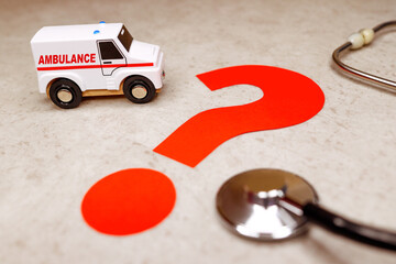 An ambulance with red question mark. © ANASTASIIA