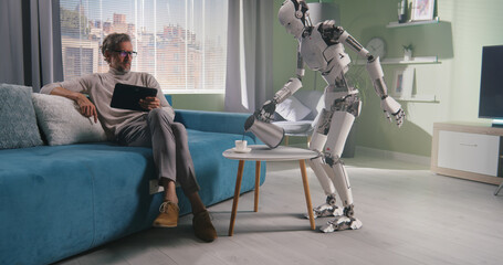 Robot preparing coffee for owner