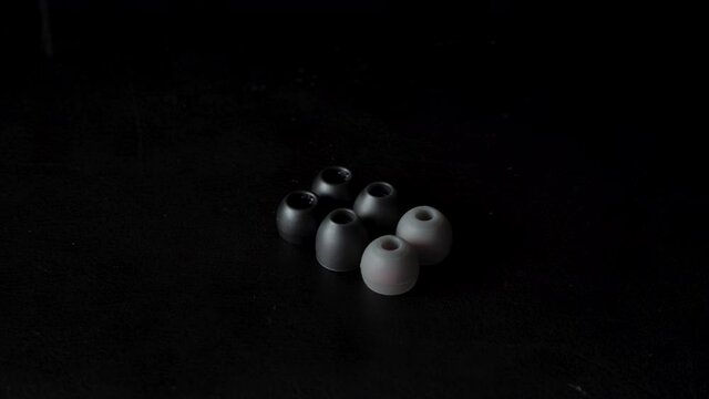 Ear tips on black surface