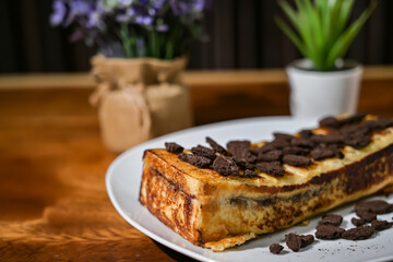 Bread toast close up view with decorative plant on wooden table