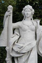 statue of a muse (?) in the gardens of the belvedere palace in vienna (austria)  - obrazy, fototapety, plakaty