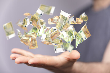 bill euro banknote in hand rain