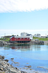 traditional fishing hut as a wooden house in a fjord in Sakrisoya Reine on the Lofoten Islands in...