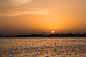 Vivid sunset view of the Beach in Fumini di Quartu, sea and clouds