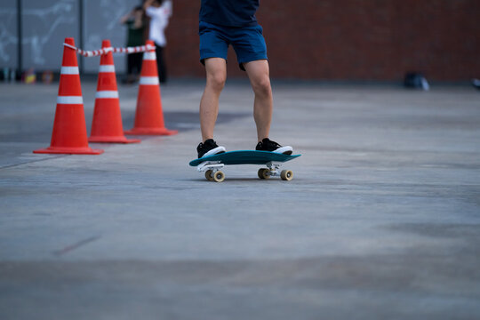 Close-up Of People​ Is Playing Surf Skate Or Skateboard Outdoors