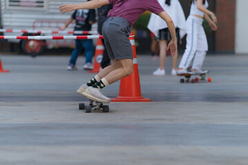 Close-up of people​ is playing surf skate or skateboard outdoors