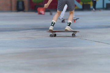 Close-up of people​ is playing surf skate or skateboard outdoors