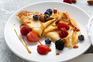 Summer crepes with berries and caramel