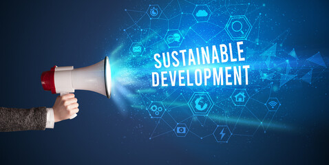 Young woman shouting in megaphone, technology announcement concept