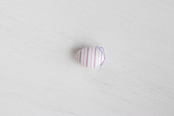 Pastel color plastic Easter eggs decoration on a light background