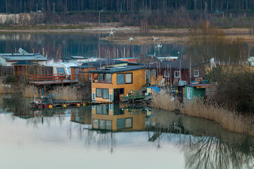 Fototapeta na wymiar anglers' houses by the lake