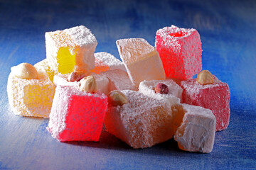 Turkish delight on blue wooden background