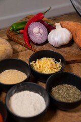 vegetables and spices on a wooden table