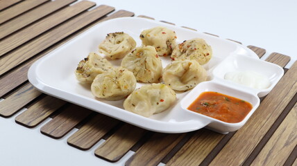Veg steam momos. Momos stuffed with vegetables and then cooked and served with sauce