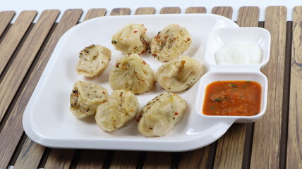 Veg steam momos. Momos stuffed with vegetables and then cooked and served with sauce