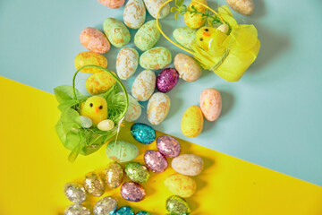 Easter eggs on the yellow-blue background. Happy Easter. Holiday concept.	