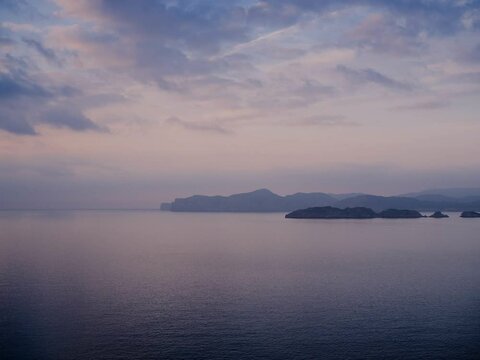 time lapse of a sunset over some islands off the coast in winter, malgrats islands
