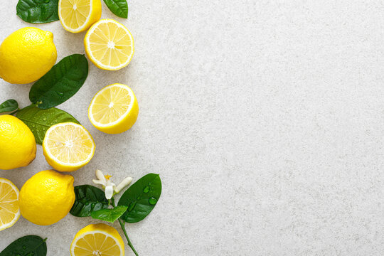 Lemons. Fresh juicy lemons with leaves on white background
