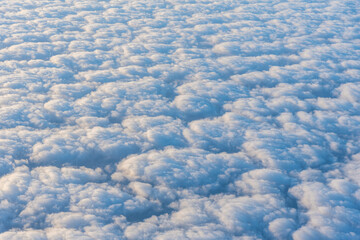 Cloudscape wallpaper with white and blue puffy clouds