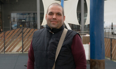 Portrait of a man smiling just on the street, ordinary people