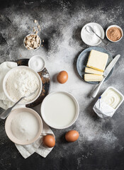 Obraz na płótnie Canvas Ingredients for cooking: milk, sugar, flour, eggs, salt, butter. Cooking time