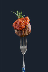 Meatball traditional kofte on fork with aivar. Spicy meatballs Kebab or Kebap Healthy eating concept. Copy space