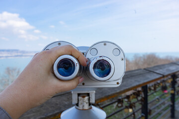 stationary paid binoculars on the observation deck overlooking the sea bay